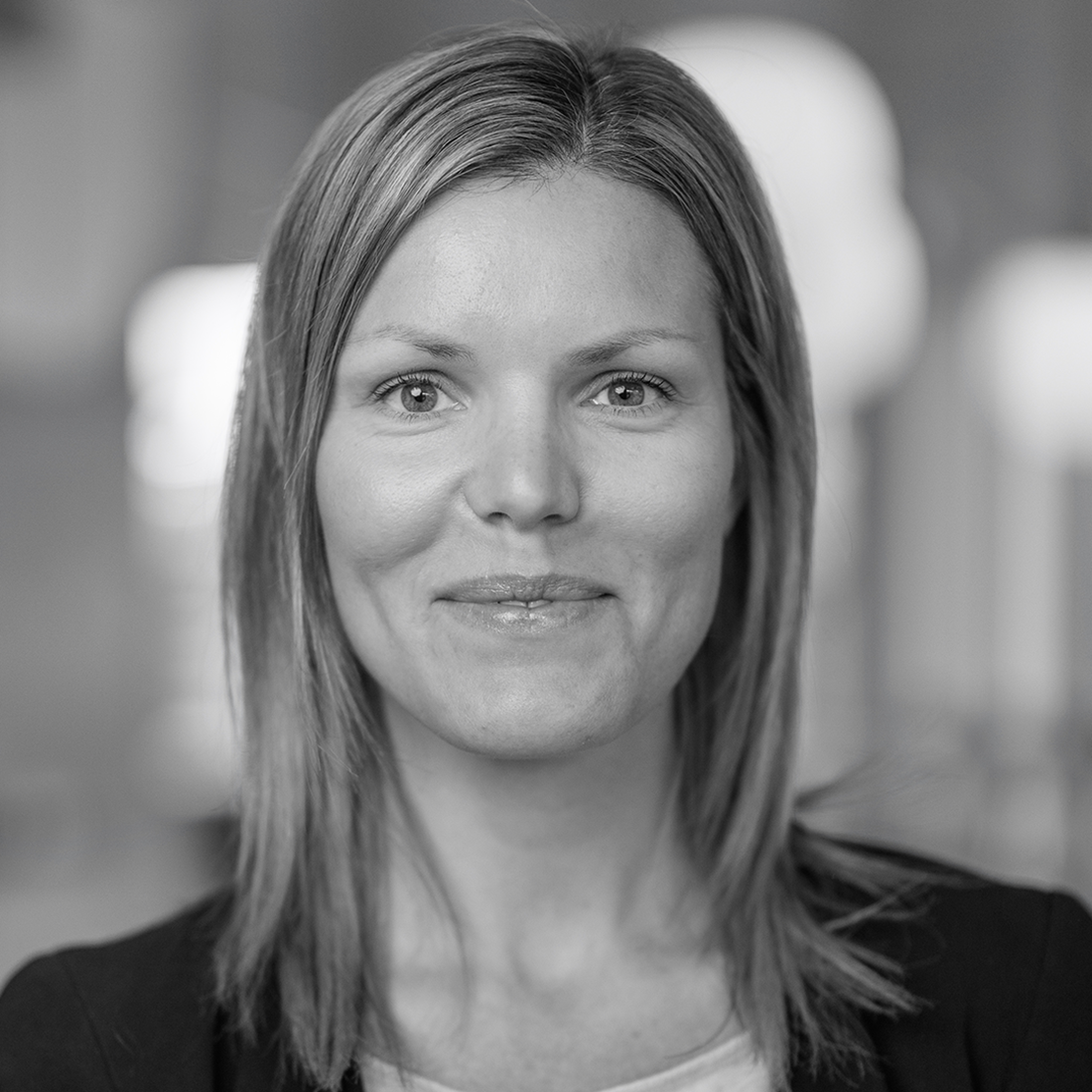 Profilbild på kvinna med kavaj